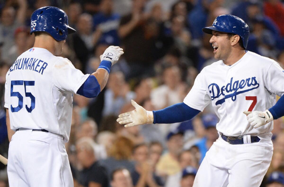 Veteran utility players Nick Punto (7) and Skip Schumaker -- celebrating a home run by Punto in a victory over the New York Mets -- bring the Dodgers much-needed postseason experience.