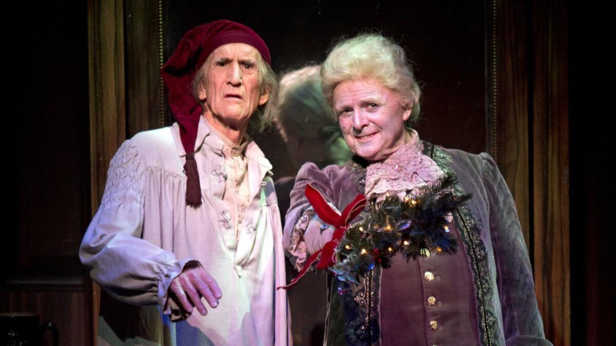 Hal Landon Jr. and Richard Doyle in the 2013 production of “A Christmas Carol.” The two actors return for South Coast Repertory’s 39th production of the annual holiday show, which runs until Dec. 24.
