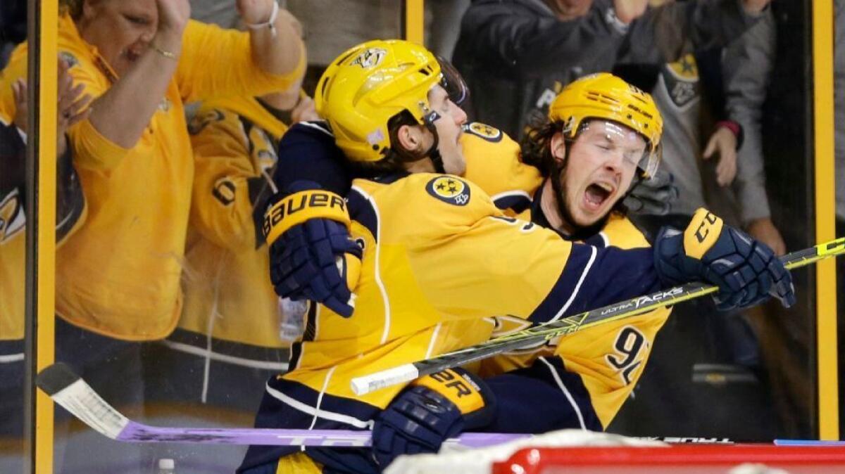 Predators forward Filip Forsberg, left, celebrates with Ryan Johansen after scoring a goal on the Ducks during the second period of a game on Nov. 12.