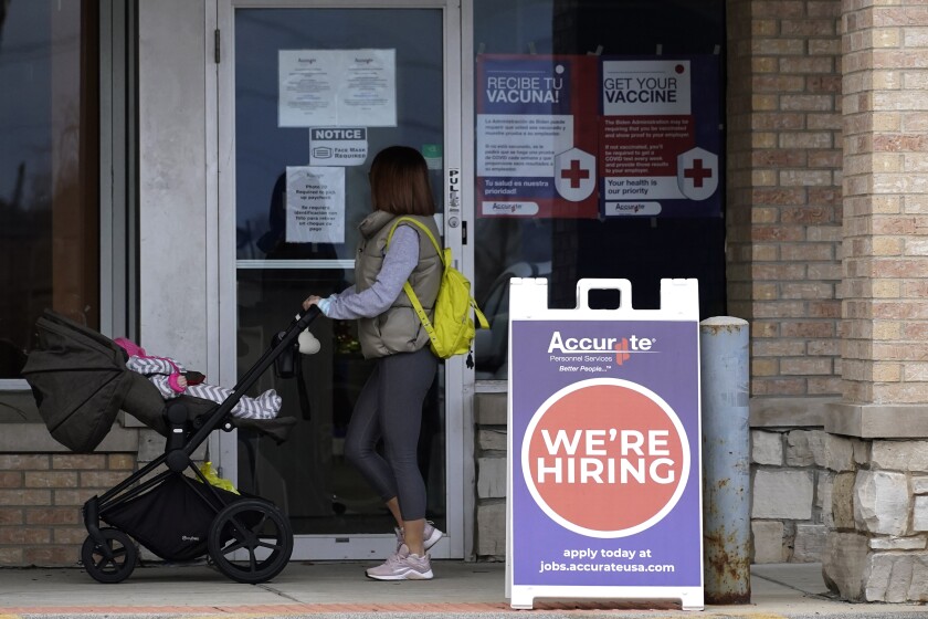 A hiring sign is seen outside of Accurate Personnel office (employment agency) in Buffalo Grove, Ill., Friday, Dec. 3, 2021. One of the fastest years of job creation in U.S. history stumbled at the finish line in December. Hobbled by shortages of workers and persistent threats from the coronavirus, U.S. employers added just 199,000 jobs last month -- fewest since December 2020 and half what economists had expected. (AP Photo/Nam Y. Huh)