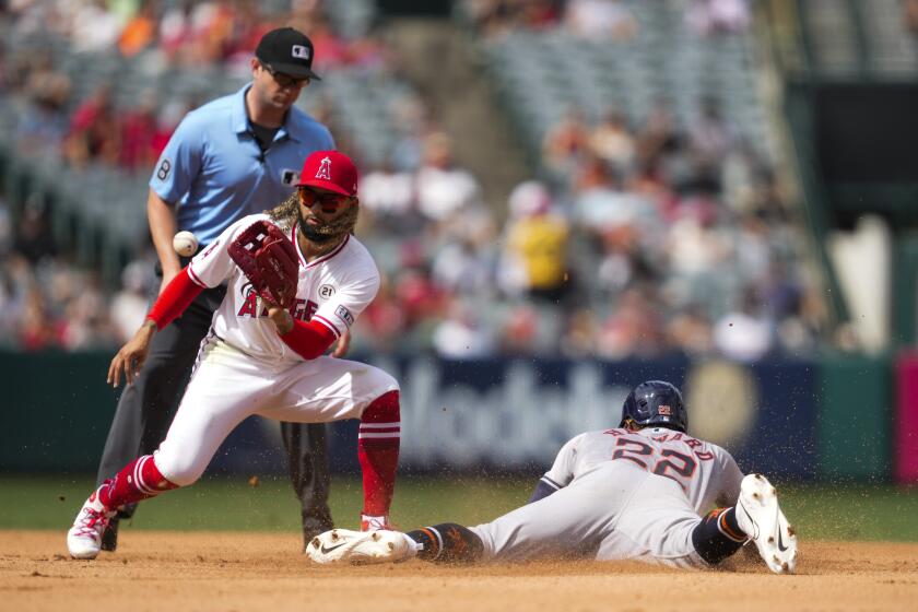 Houston Astros' Jason Heyward (22) steals second base ahead of a throw to Los Angeles Angels second baseman Jack López during the sixth inning of a baseball game in Anaheim, Calif., Sunday, Sept. 15, 2024. (AP Photo/Ashley Landis)