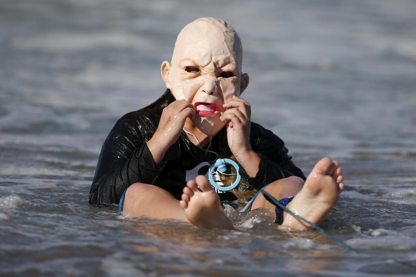 Joey Callhehan, 13, competes dressed as a baby during the ZJ Boarding House Haunted Heats Halloween Surf Contest in Santa Monica