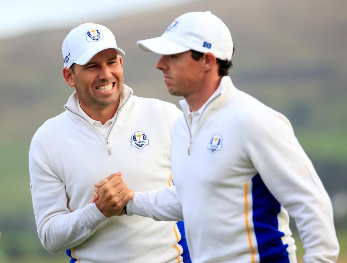 Sergio Garcia and Rory McIlroy of Europe celebrate on the 14th green at Gleneagles on Saturday at the Ryder Cup. Garcia and McIlroy defeated Jim Furyk and Hunter Mahan of the United States, 3 and 2.