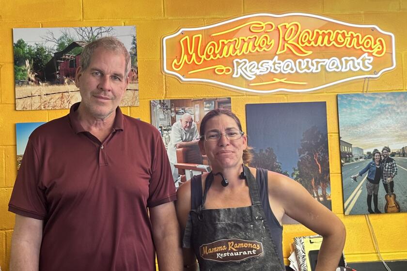 Andrew Simmons is phasing out his ownership of Mamma Ramona’s Pizzeria so his employee, Jessica Frankenberg, can take charge.