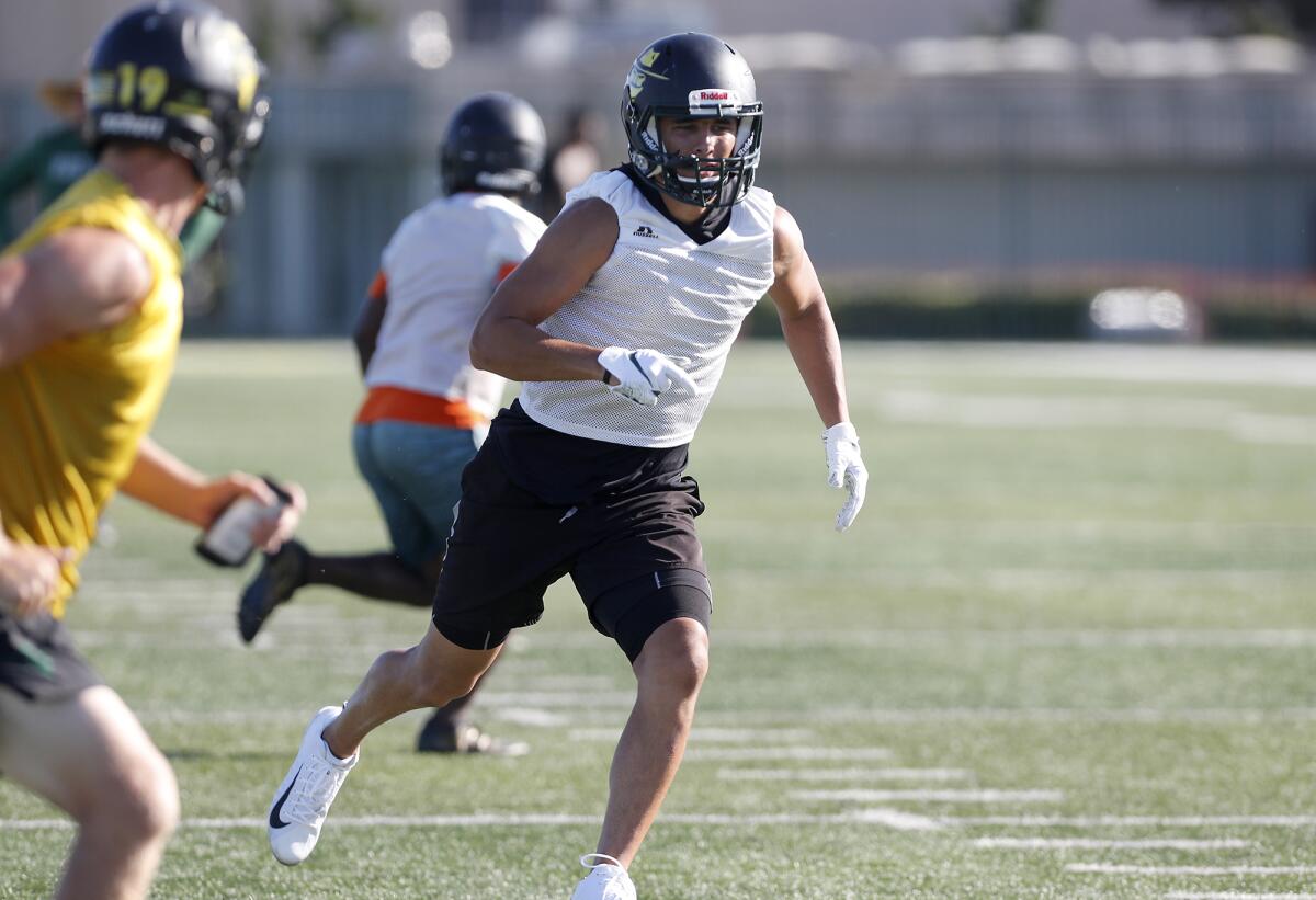 Golden West College wide receiver David Atencio runs a route during a practice in Huntington Beach.