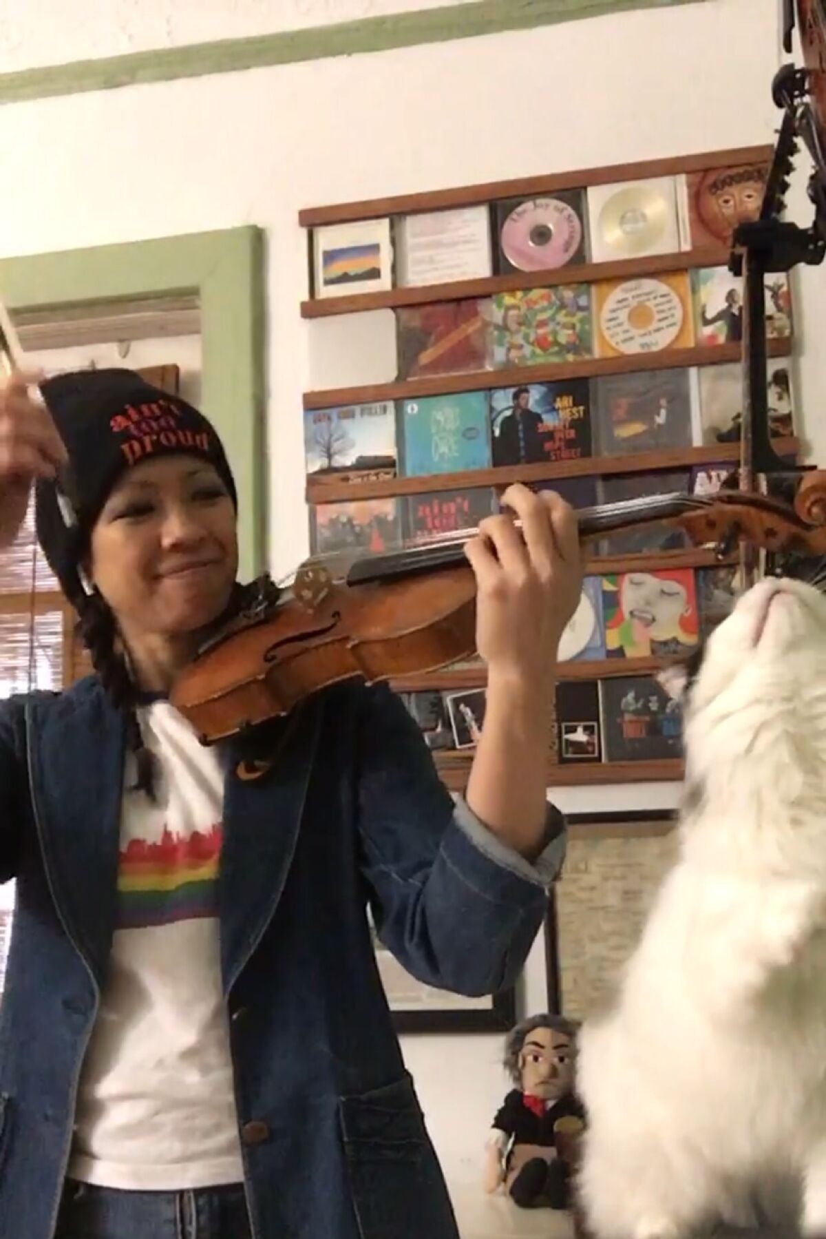Violinist Melissa Tong's cat Chloe steals a scene while Tong makes a remote appearance on "PBS NewsHour."