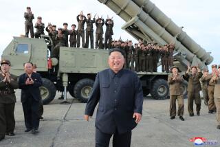 This Saturday, Aug. 24, 2019, photo provided Sunday, Aug. 25, by the North Korean government, shows North Korean leader Kim Jong Un, center, smiles after the test firing of an unspecified missile at an undisclosed location in North Korea. North Korea fired two suspected short-range ballistic missiles off its east coast on Saturday in the seventh weapons launch in a month, South Korea's military said, a day after it vowed to remain America's biggest threat in protest of U.S.-led sanctions on the country. The content of this image is as provided and cannot be independently verified. Korean language watermark on image as provided by source reads: "KCNA" which is the abbreviation for Korean Central News Agency. (Korean Central News Agency/Korea News Service via AP)