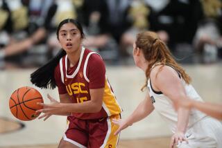 USC guard Kayla Padilla controls the ball in front of Colorado's Frida Formann.
