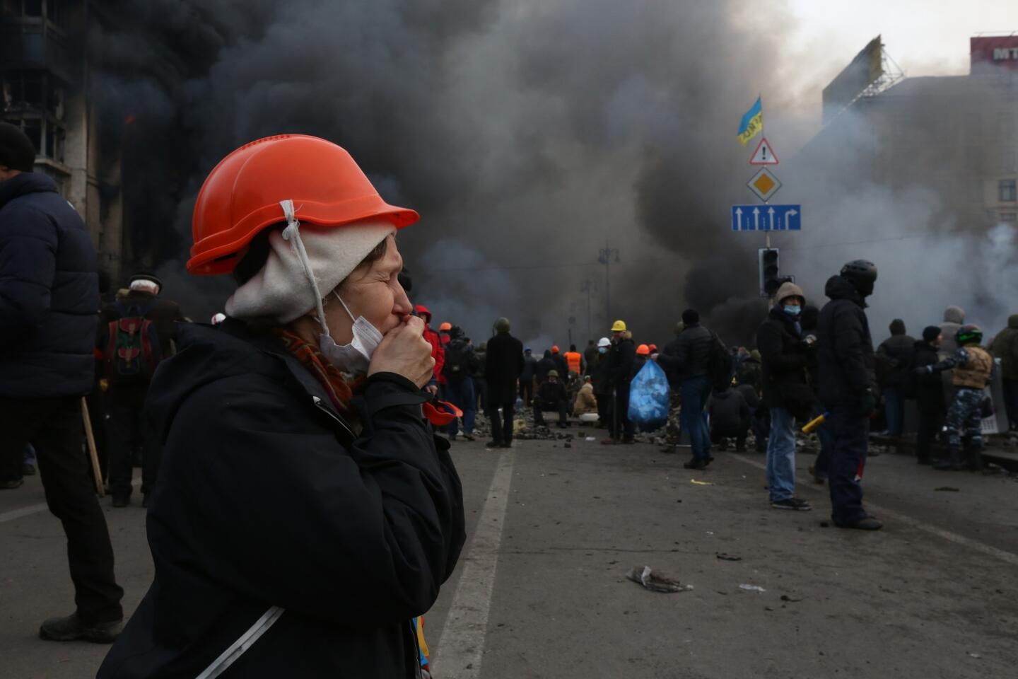 A protester prays in the middle of Independence Square in Kiev.