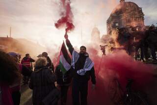 People gather to take part in a pro-Palestinian rally in Berlin, Germany, Saturday Nov. 4, 2023. (Joerg Carstensen/dpa via AP)