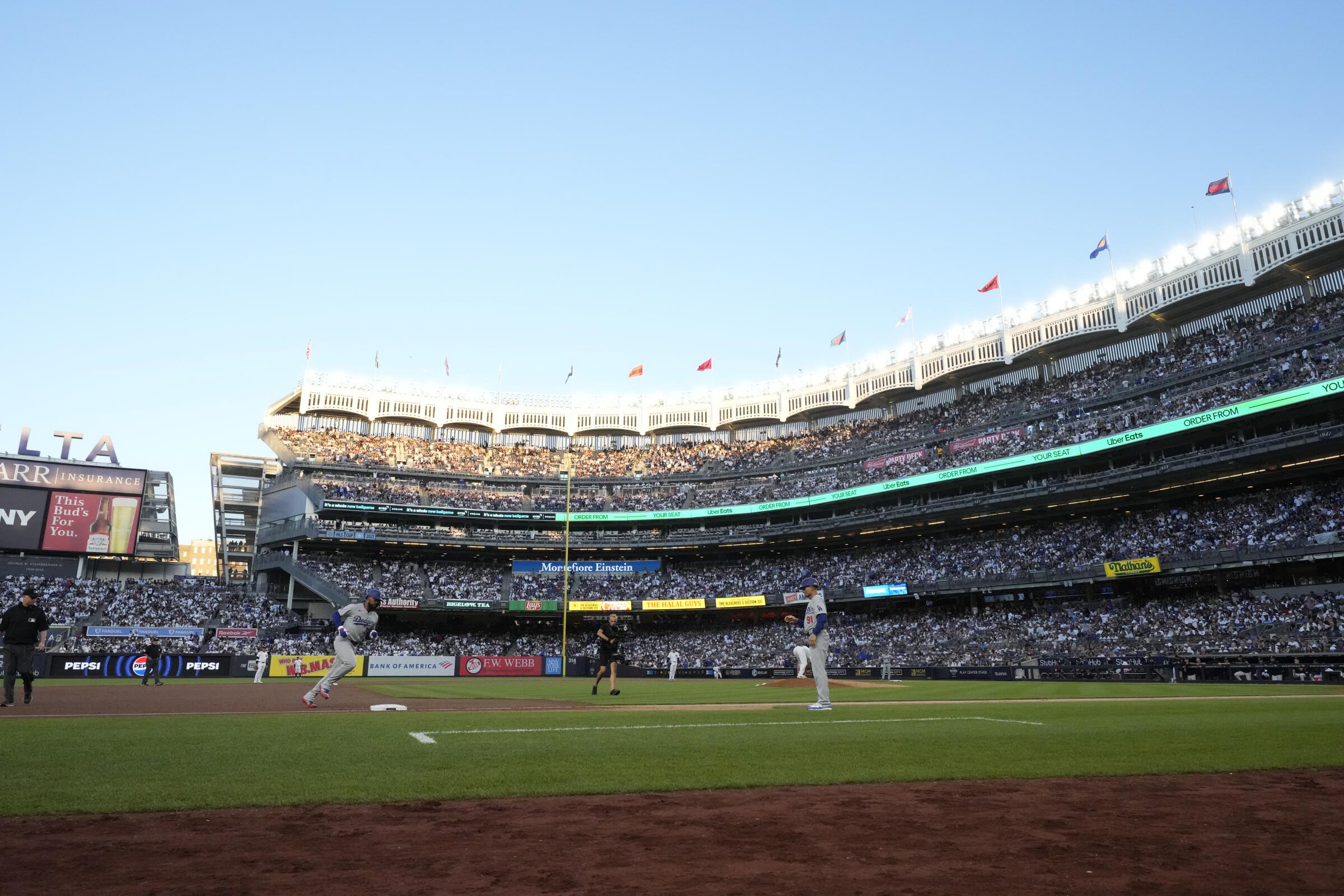 The Dodgers' Teoscar Hernández runs the bases after hitting a home run in Yankee Stadium on June 8.