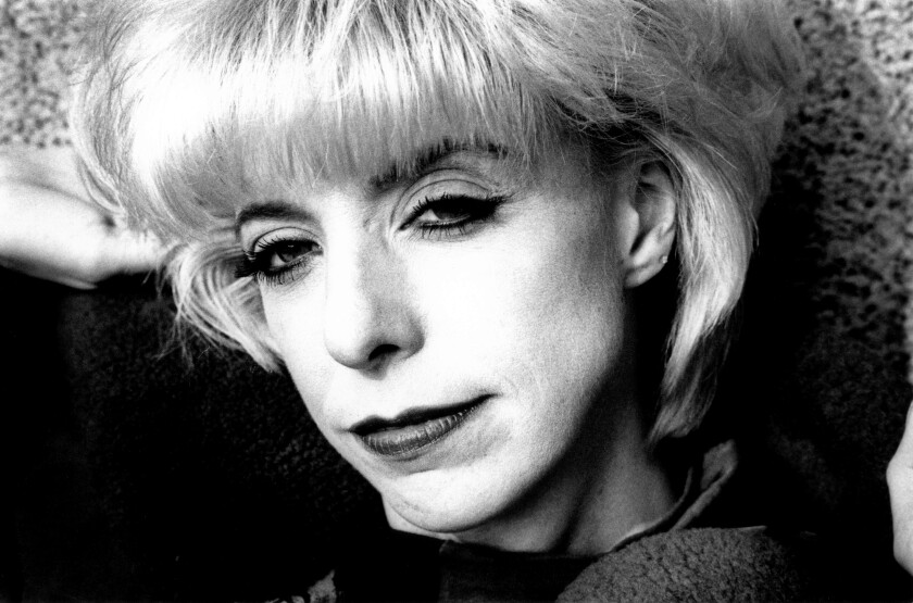 Black and white close-up photograph of a blonde woman