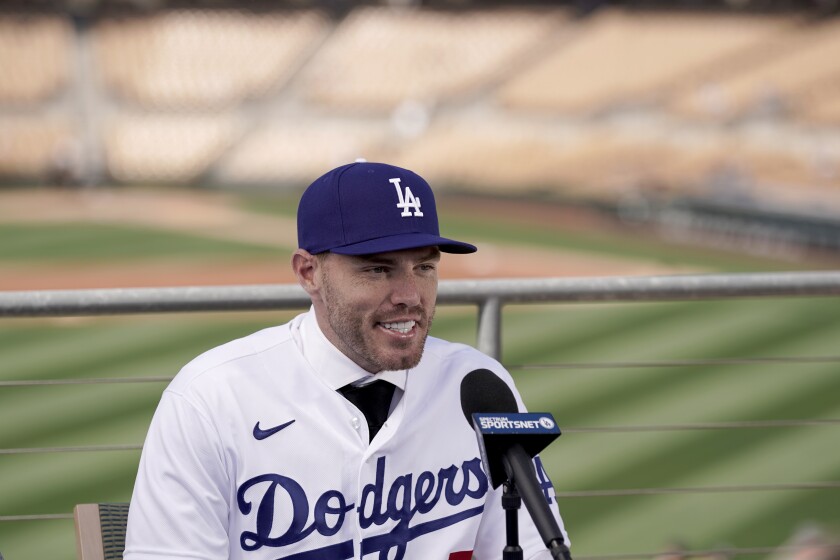 New Dodger Freddie Freeman speaks during an introductory news conference at spring training March 18, 2022.