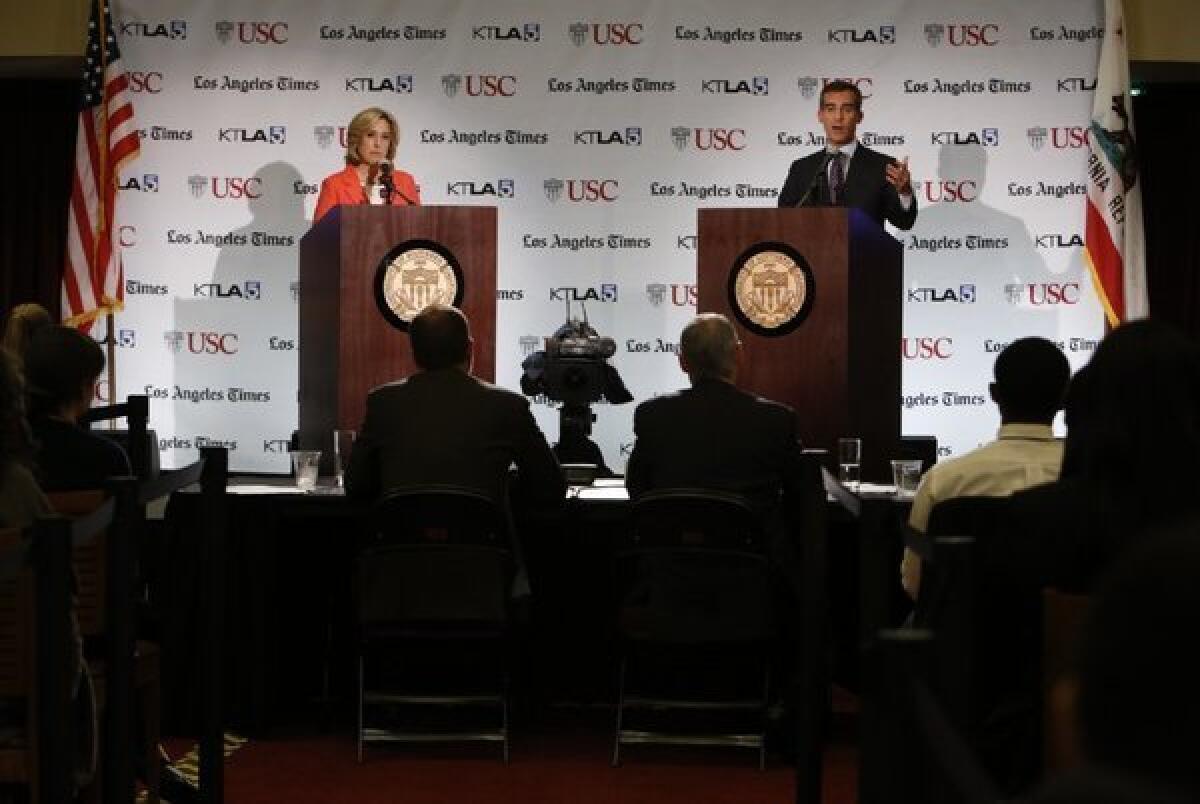 City Councilman Eric Garcetti, right, participates in a mayoral debate and town hall with City Controller Wendy Greuel hosted by the USC Jesse M. Unruh Institute of Politics and the Los Angeles Times in the Founders Room at the USC Galen Center.