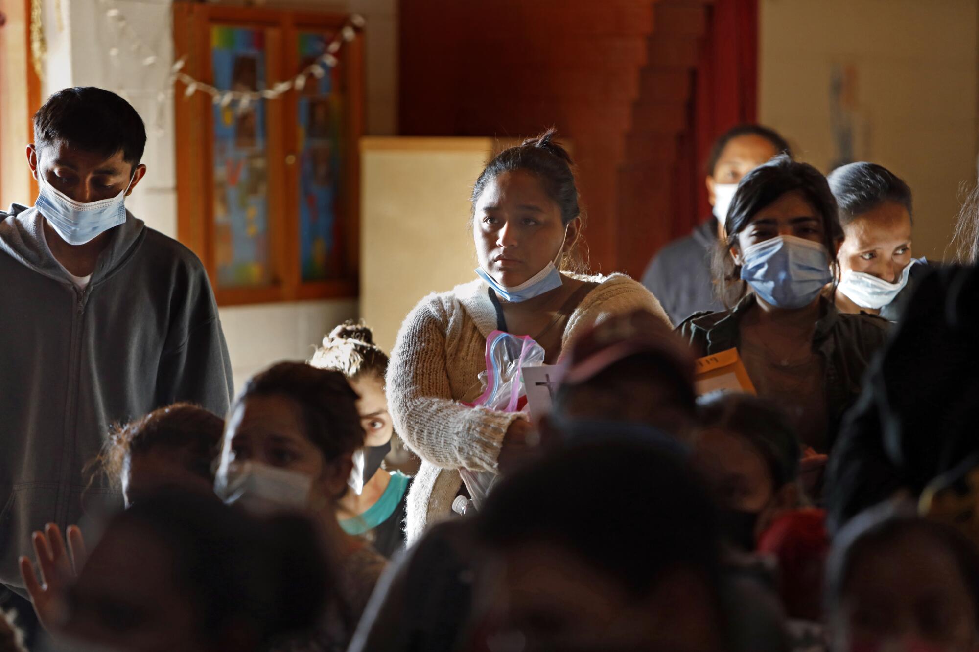Migrants from Honduras and Guatemala are temporarily staying at a shelter in Mission, Texas.