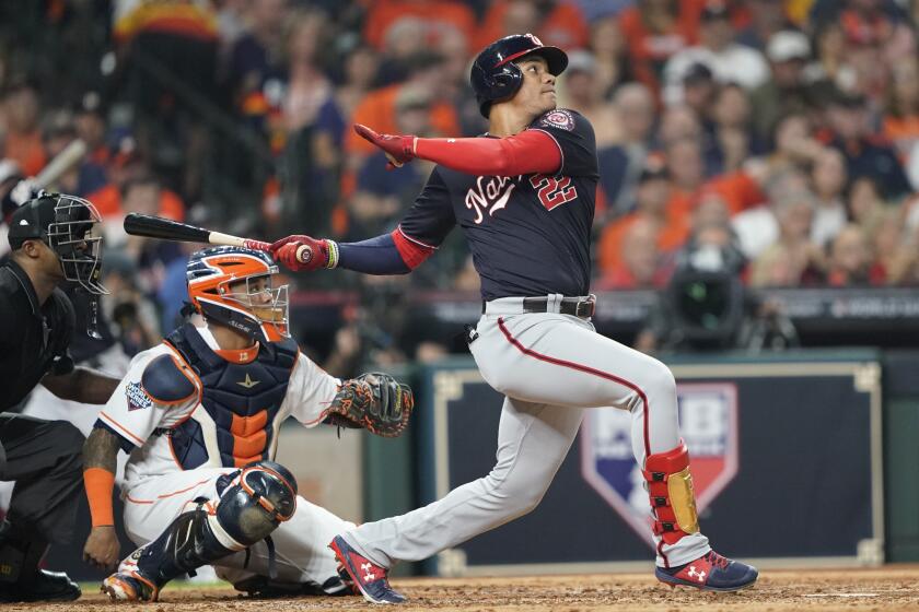 Washington Nationals' Juan Soto hits a home run during the fourth inning of Game 1 of the baseball World Series against the Houston Astros Tuesday, Oct. 22, 2019, in Houston. (AP Photo/David J. Phillip)