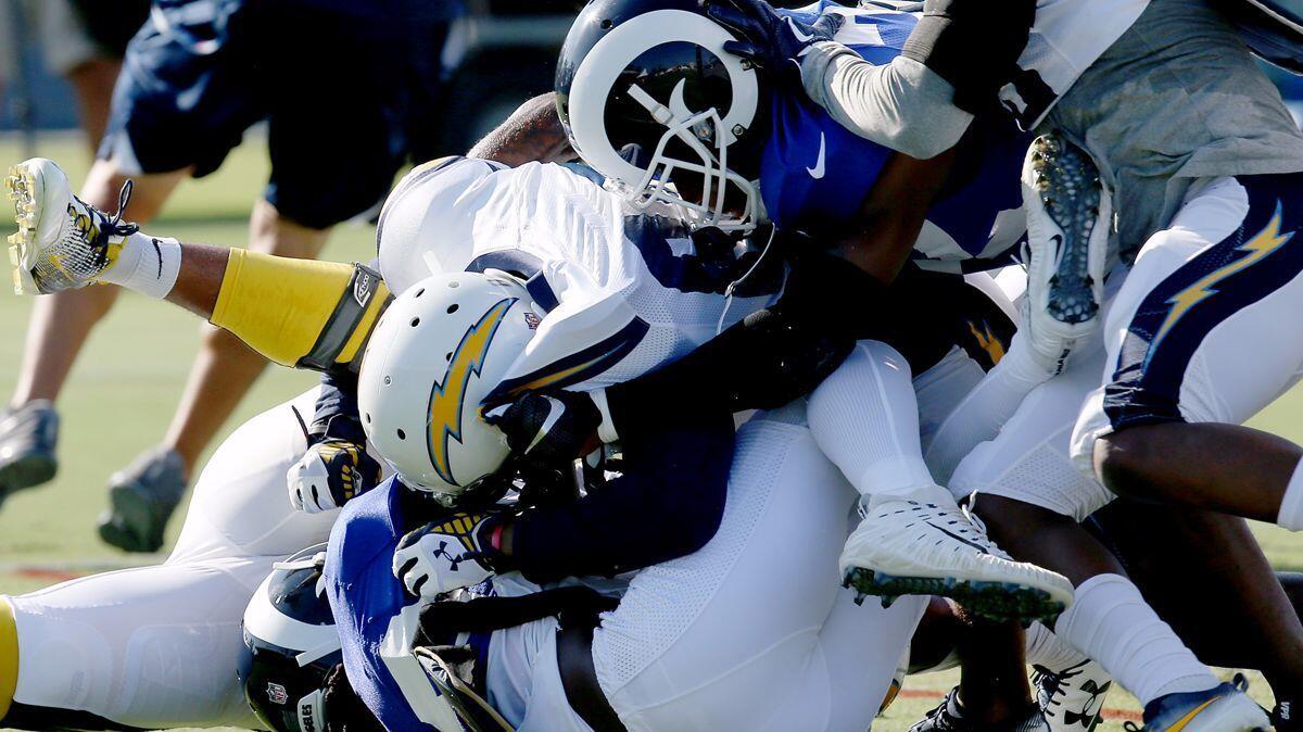 Chargers and Rams players get into a tussle during a joint practice between the teams at UC Irvine on Wednesday.