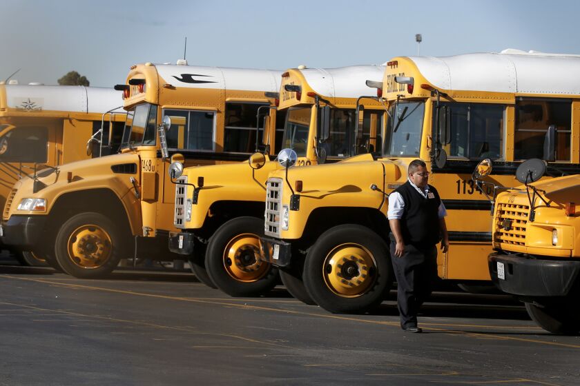 LAUSD school buses sit idle in the Gardena Garage after school officials closed all campuses in the district following an unspecified threat.