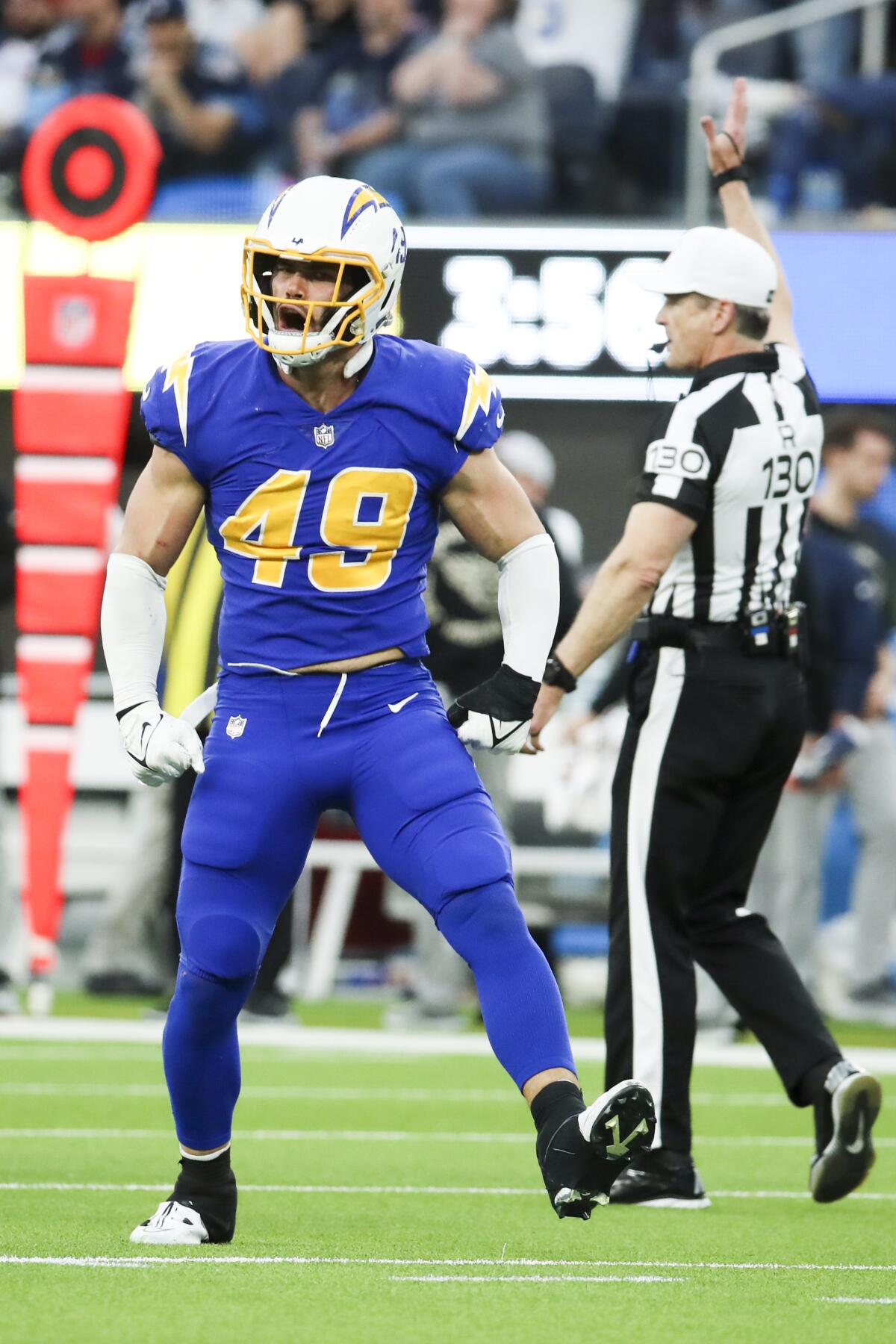 Chargers linebacker Drue Tranquill celebrates a sack.