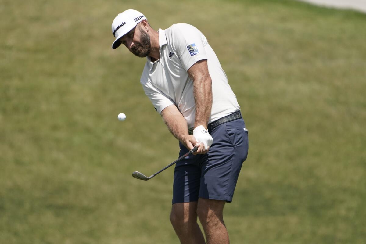 Dustin Johnson chips onto the 11th green during a practice round for the U.S. Open on Tuesday at Torrey Pines.