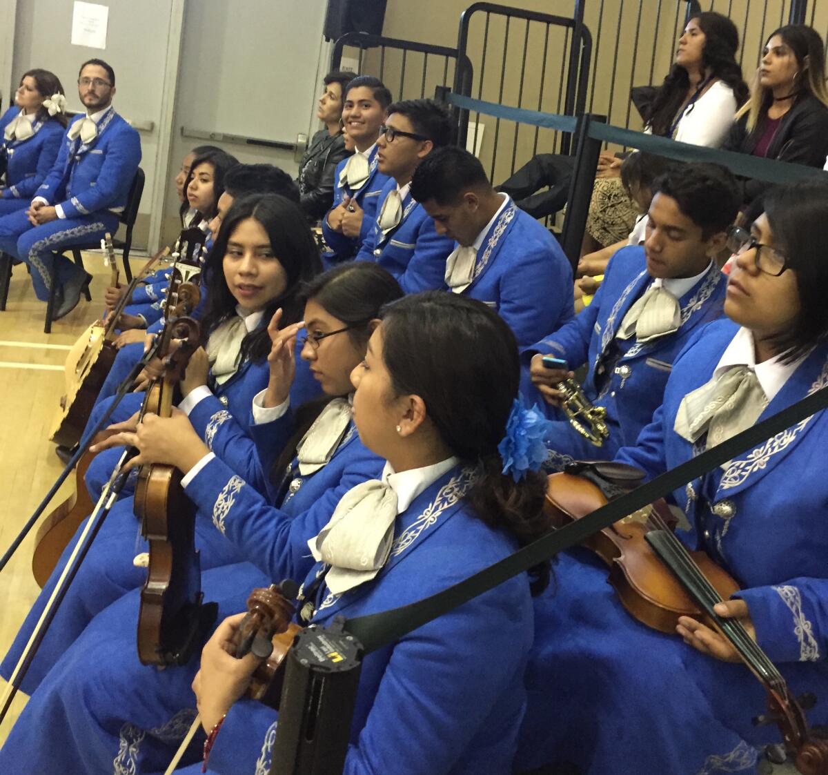 Members of Los Jaguares, the Mendez High School mariachi group, wait to perform at the graduation ceremony.