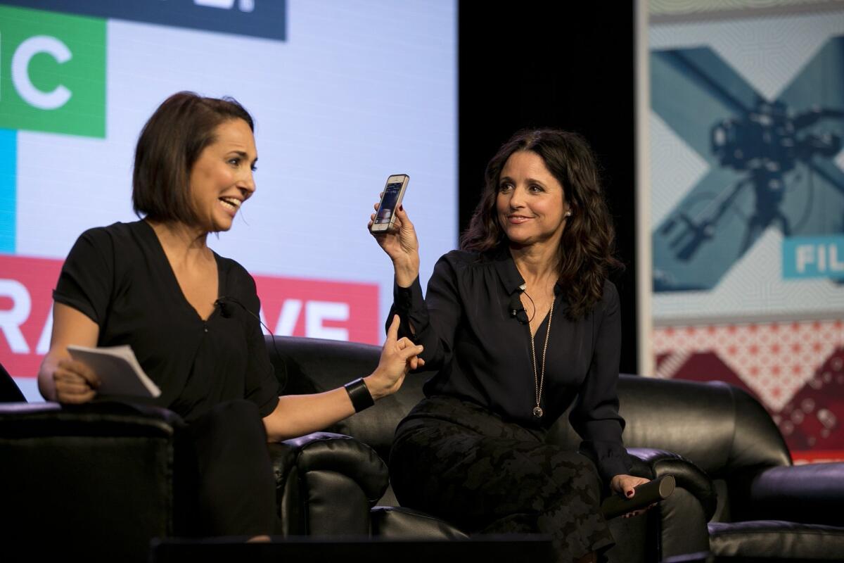 Anne Fulenwider, editor in chief of Marie Claire, interviews Julia Louis-Dreyfus, right, as she uses the Meerkat app during the South by Southwest festival in March.