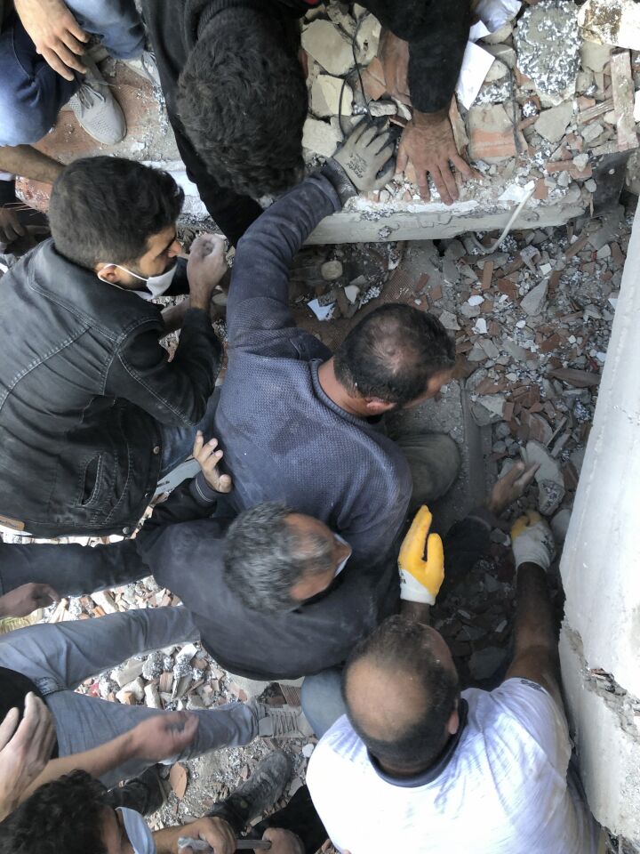 Rescue workers did through rubble of a collapsed building to try to reach trapped residents in Izmir, Turkey