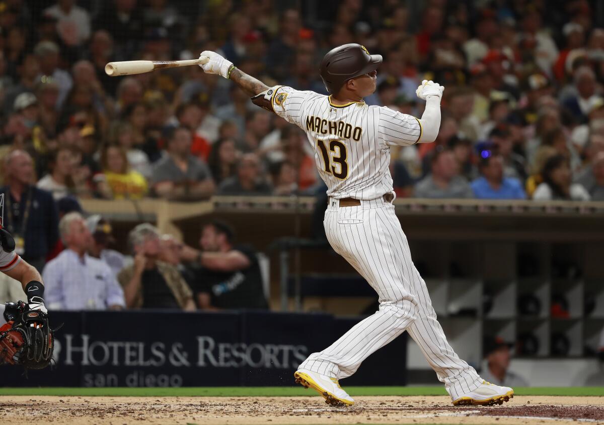 Padres' Manny Machado hits a home run in the third inning against the San Francisco Giants.