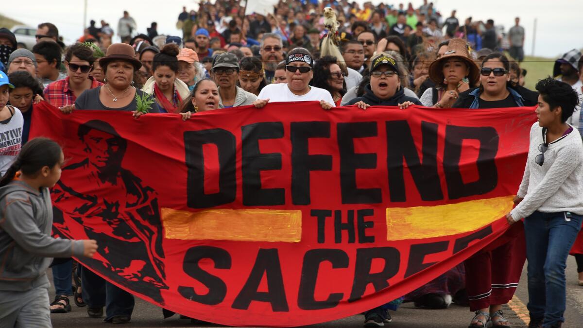A coalition of Native Americans march on Sept. 4 to a sacred burial ground disturbed by bulldozers building the Dakota Access Pipeline.