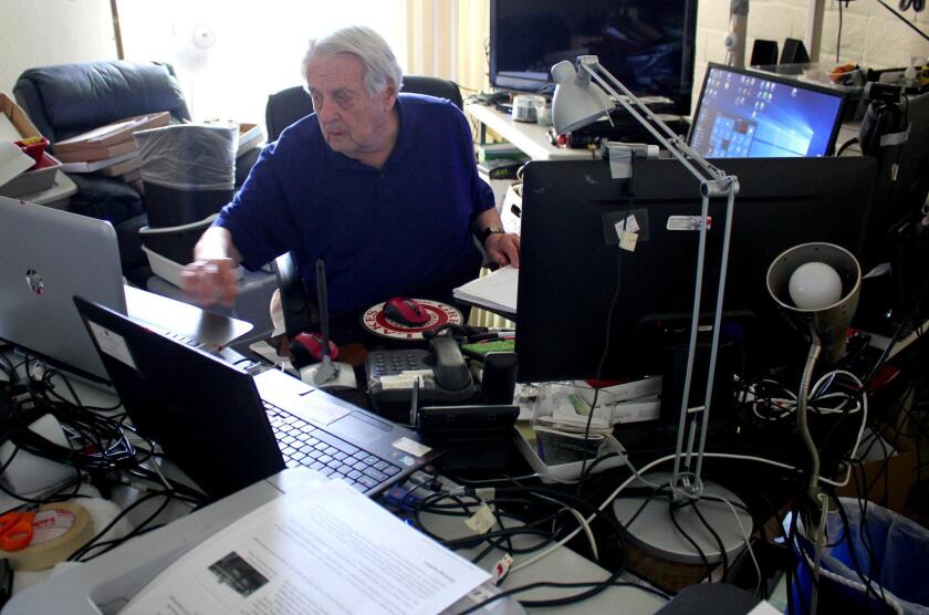 John Ellison in his man cave at Casa de Manana. Here, the 85-year-old former electronics engineer Skypes with family and friends, reads online aeronautical journals and monitors global economic trends.