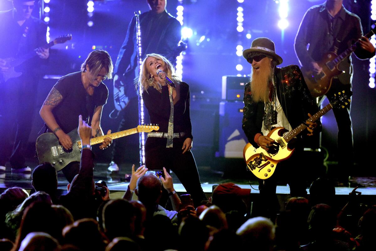 Keith Urban, left, Miranda Lambert and Billy Gibbons onstage at the 51st ACM Awards.