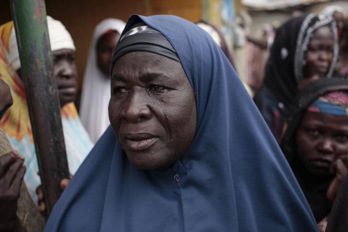 A woman cries upon learning that her relatives were killed by Boko Haram in Gwoza, Nigeria in April 2015.