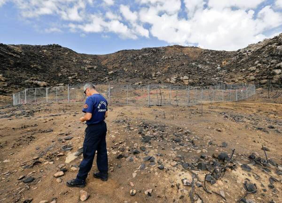 Prescott firefighter Wade Ward last month visits the site in Yarnell, Ariz., where 19 firefighters died.