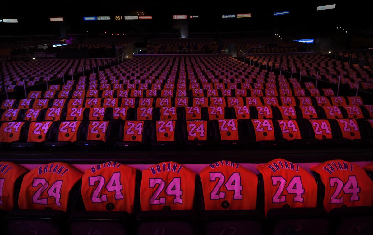 Kobe Bryant T-shirt jerseys cover seats at Staples Center before Friday's game between the Lakers and Portland Trail Blazers.