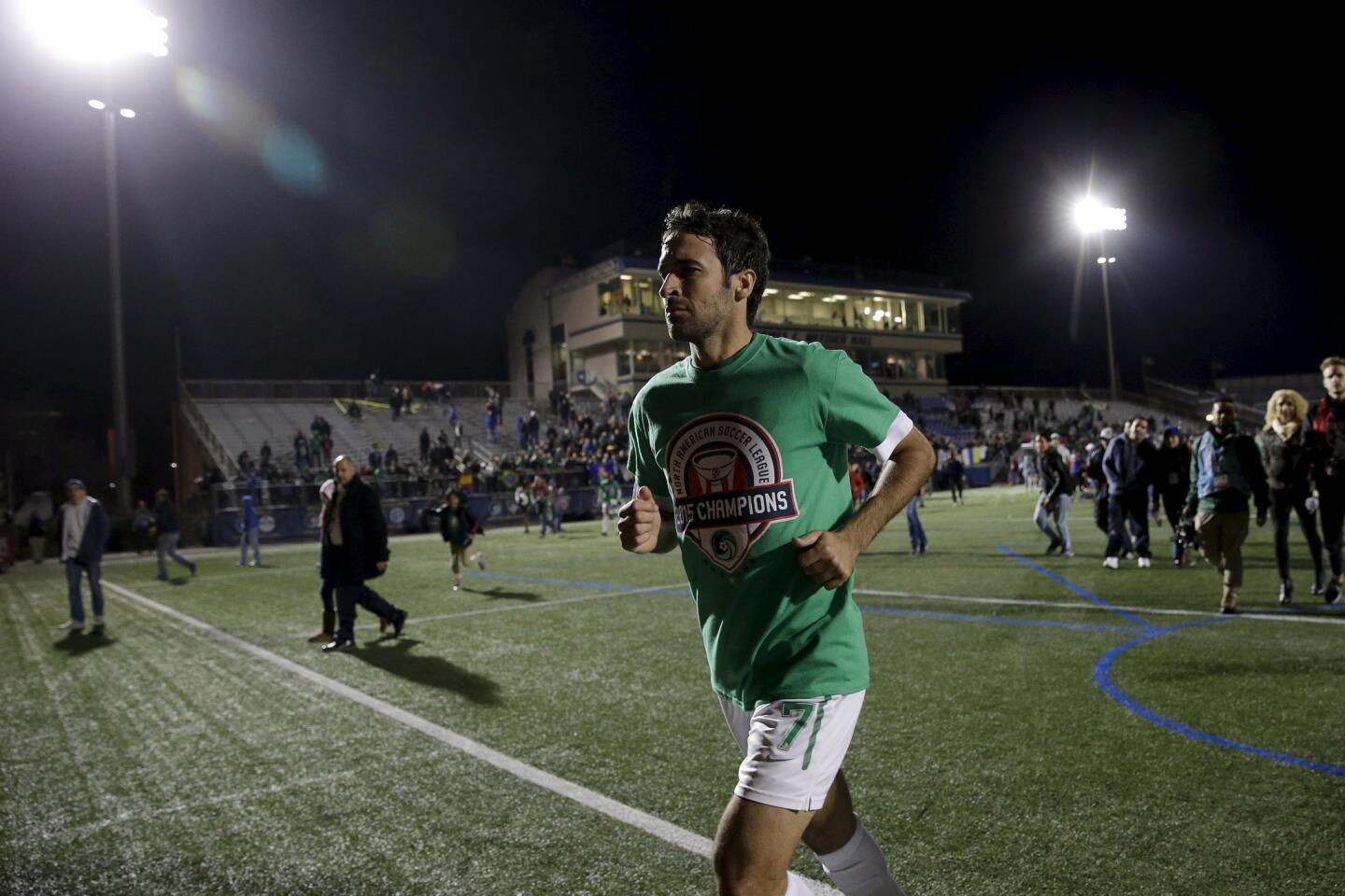 New York Cosmos' Raul runs off the field following his team's win over the Ottawa Fury in the NASL Championship Finals in Hempstead