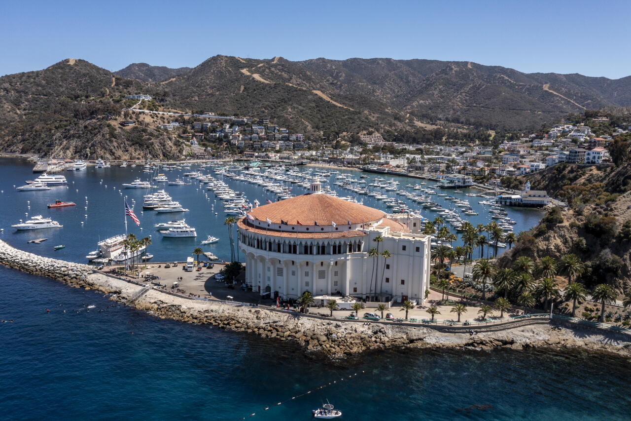 An aerial view of boats moored at Avalon Harbor and the Catalina Casino.