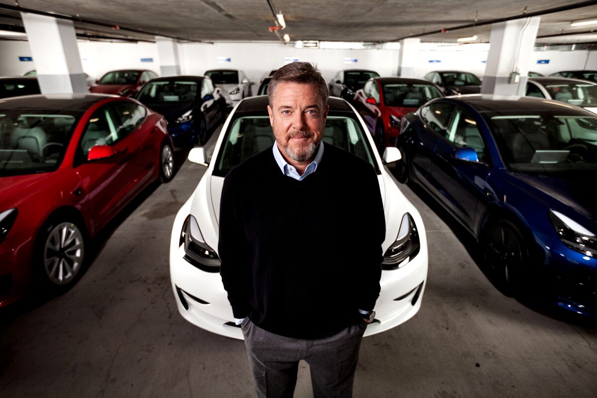 Autonomy co-founder and chief executive Scott Painter is seen with several Model 3s.