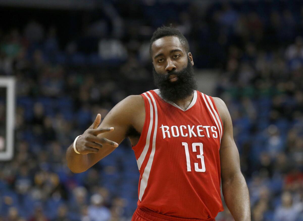 Rockets guard James Harden reacts after making a basket during a game last season.