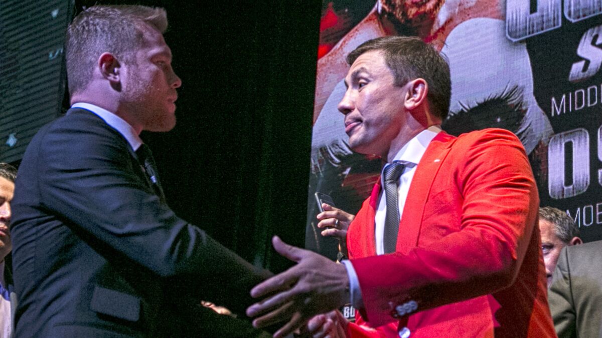 Boxers Canelo Alvarez, left, and Gennady Golovkin shake hands at the conclusion of a promotional event at the Avalon Hollywood on Thursday.
