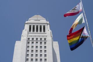 The LGBTQ+ Pride Flag, bottom, flies for the first time with the California State, top, and Los Angeles City flags during the month of Pride outside Los Angeles City Hall to mark Pride Month in Los Angeles, Thursday, June 6, 2024. (AP Photo/Damian Dovarganes)