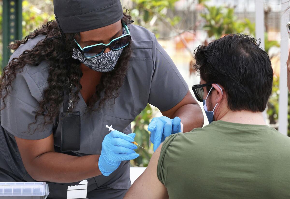 An Orange County resident receives the COVID-19 vaccine in Florida