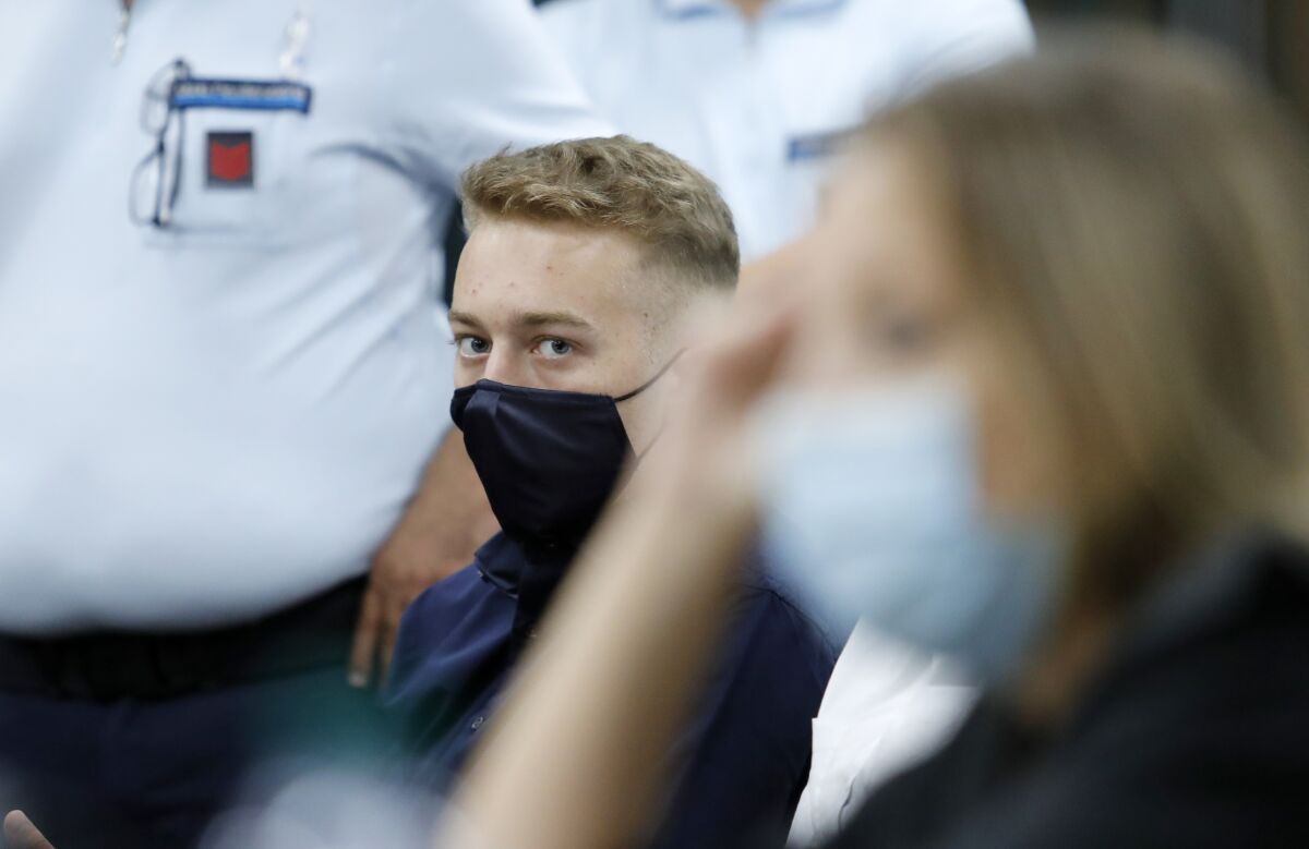 Finnegan Lee Elder, from California, looks on during a break in his trial where he and his friend Gabriel Natale-Hjorth are accused of slaying a plainclothes Carabinieri officer while on vacation in Italy last summer, in Rome, Wednesday, Sept. 16, 2020. (Remo Casilli/Pool Photo via AP)