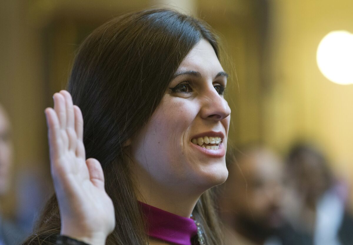 FILE - Del. Danica Roem, D-Prince William, the first transgender delegate, takes her oath of office during opening ceremonies of the 2018 session of the Virginia House of Delegates at the Capitol in Richmond, Va., Jan. 10, 2018. Roem, who made history as an openly transgender candidate in her initial bid for state office, announced Monday, May 9, 2022, she is jumping into a 2023 race for an open northern Virginia state Senate seat. (AP Photo/Steve Helber, File)