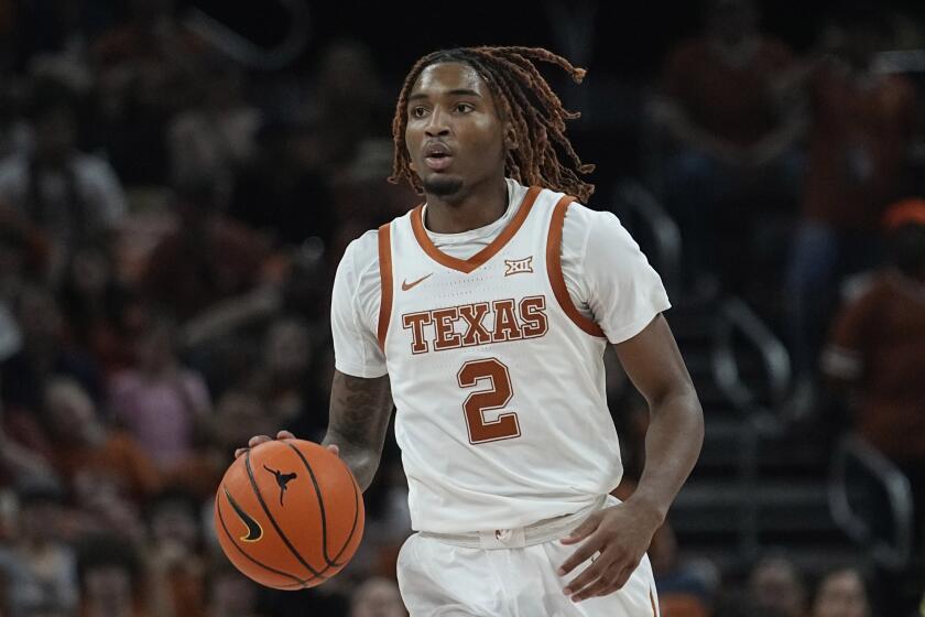 FILE - Texas guard Arterio Morris brings the ball up during the second half of the team's NCAA college basketball game against Arkansas-Pine Bluff in Austin, Texas, Dec. 10, 2022. Morris, now at Kansas, has entered a plea deal to end a misdemeanor assault case against him in Texas, canceling a trial scheduled for October, his attorney said Thursday, Sept. 14, 2023. Morris was originally charged with a Class A misdemeanor on allegations he assaulted an ex-girlfriend in June 2022, shortly before he enrolled at Texas. Morris transferred to Kansas after the 2022-2023 season. (AP Photo/Eric Gay, File)