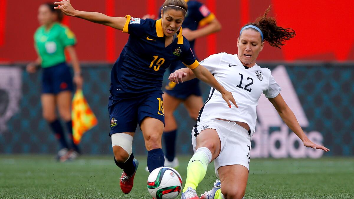 U.S. midfielder Lauren Holiday and Australia midfieler Katrina Gorry battle for possession of the ball during their Women's World Cup group game on Monday.