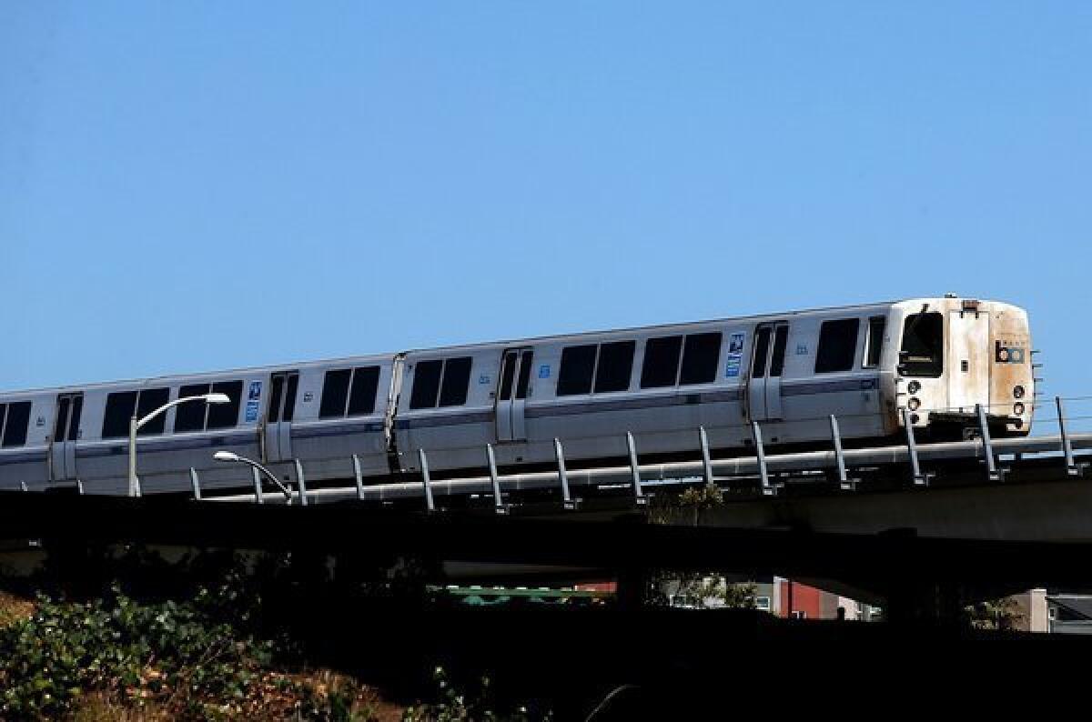 A Bay Area Rapid Transit (BART) train travels toward downtown Oakland.
