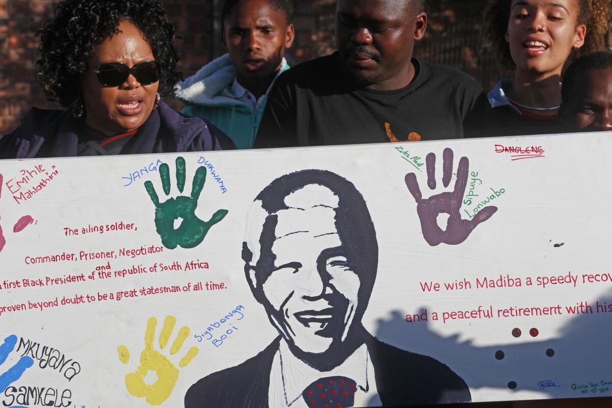 Visitors from the Nelson Mandela museum bring messages of support to the home of the former South African president in the village of Qunu.