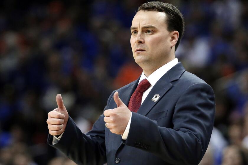 FILE - In this March 29, 2014, file photo, Dayton head coach Archie Miller gestures during the first half in a regional final game at the NCAA college basketball tournament against Florida in Memphis, Tenn. Indiana has hired Miller as its new coach on Saturday, March 25, 2017. (AP Photo/Mark Humphrey, File)