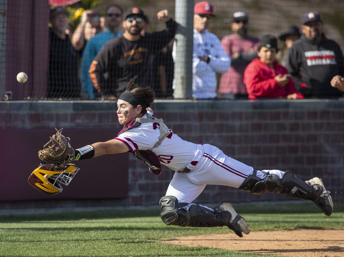 Ocean View's Evyn Lewis dives for a foul ball during a Golden West League finale against Segerstrom on Thursday.