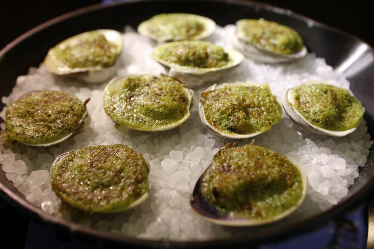 Clams prepared by Chef Michael Cimarusti (CQ) from Providence and Connie and Ted's restaurant. Recipe: Broiled clams with herbed butter